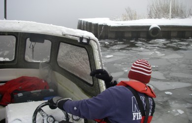Sampling in all weather; boat on Loch Leven in snow and ice.